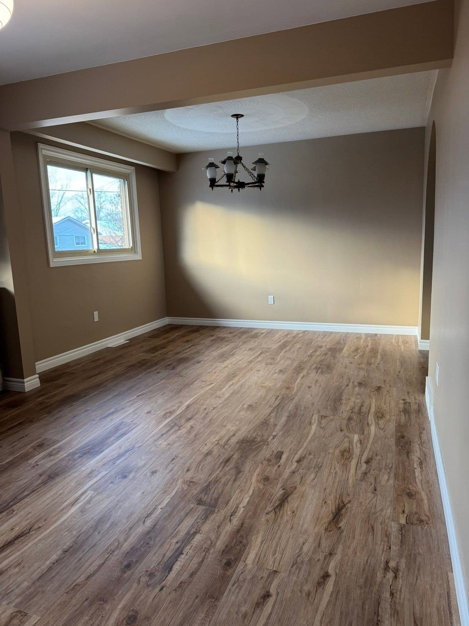 New wood-look vinyl plank flooring in a dining room